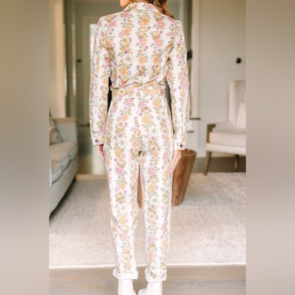 Ivory White Floral Jumpsuit. Brand new, never worn. Purchased from a boutique.